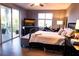 Large, bright primary bedroom with balcony access and comfortable furnishings at 750 4Th S Ave # 403C, St Petersburg, FL 33701