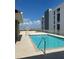 Rooftop swimming pool area with city views and lounge seating on a sunny day at 750 4Th S Ave # 403C, St Petersburg, FL 33701