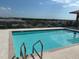 Relaxing swimming pool area with city views and trees surrounding it at 750 4Th S Ave # 403C, St Petersburg, FL 33701