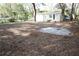 Expansive backyard offers a serene environment with mature trees and ample space for outdoor activities at 7932 Palatine Dr, Hudson, FL 34667