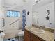 Well-lit bathroom with a shower-tub combination and ample counter space at 811 College Leaf Way, Ruskin, FL 33570