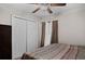 Bedroom with queen bed, ceiling fan, and closet providing ample storage space at 811 College Leaf Way, Ruskin, FL 33570