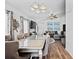 Open-concept dining area connected to the living room, featuring modern furniture and ample natural light at 811 College Leaf Way, Ruskin, FL 33570