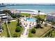 Aerial view of the community pool, beach, and surrounding buildings with ample lounge areas at 825 S Gulfview Blvd # 202, Clearwater Beach, FL 33767