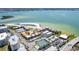 Gorgeous aerial view of the condos by the ocean and beach with tennis courts and pool at 825 S Gulfview Blvd # 202, Clearwater Beach, FL 33767