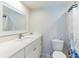 Bathroom features a modern sink vanity and toilet with nautical themed shower curtain at 825 S Gulfview Blvd # 202, Clearwater Beach, FL 33767