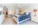 Bright bedroom with white furniture, a queen-size bed, and access to an ensuite bathroom at 825 S Gulfview Blvd # 202, Clearwater Beach, FL 33767