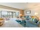 Bright living room with water view, comfortable seating, and access to a spacious outdoor balcony at 825 S Gulfview Blvd # 202, Clearwater Beach, FL 33767