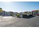 Condominium parking area featuring covered parking spaces with residential buildings in the background at 825 S Gulfview Blvd # 202, Clearwater Beach, FL 33767