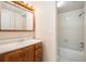 Bathroom featuring vanity with a sink and full tiled shower and tub at 8302 W Pocahontas Ave, Tampa, FL 33615
