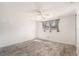 Bright bedroom with a ceiling fan and large window at 8302 W Pocahontas Ave, Tampa, FL 33615