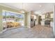 Modern kitchen featuring stainless steel appliances and an eat-in area with tile floors at 8302 W Pocahontas Ave, Tampa, FL 33615