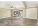 The living room features tile flooring, large window, and a modern ceiling fan at 8302 W Pocahontas Ave, Tampa, FL 33615
