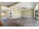 Spacious living room with tile flooring and an open layout flowing into the kitchen at 8302 W Pocahontas Ave, Tampa, FL 33615