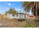 Backyard with lush green grass and beautiful plants offering plenty of space for outdoor activities and relaxation at 9135 Suffolk Ln, Port Richey, FL 34668
