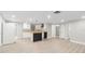 Open-concept kitchen with white cabinets, butcher block countertops, and modern black accents at 9135 Suffolk Ln, Port Richey, FL 34668