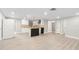 Bright kitchen with white cabinets, butcher block counters, and an island with black vertical accents at 9135 Suffolk Ln, Port Richey, FL 34668
