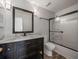 Renovated bathroom with a dark vanity and tiled shower at 9481 Highland Oak Dr Dr # 508, Tampa, FL 33647