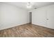 Neutral bedroom with wood floors and ceiling fan at 9481 Highland Oak Dr Dr # 508, Tampa, FL 33647