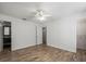 Bedroom with wood floors, ceiling fan and bathroom access at 9481 Highland Oak Dr Dr # 508, Tampa, FL 33647