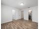 Bright bedroom featuring wood-look floors and neutral walls at 9481 Highland Oak Dr Dr # 508, Tampa, FL 33647