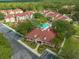 Aerial view of the community, pool, clubhouse, and landscaping at 9481 Highland Oak Dr Dr # 508, Tampa, FL 33647