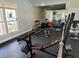 Community gym equipped with weight machines, free weights, exercise balls, and a mirrored wall at 9481 Highland Oak Dr Dr # 508, Tampa, FL 33647