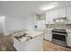 Open kitchen featuring a large island with marble countertop, perfect for meal preparation and entertaining guests at 9481 Highland Oak Dr Dr # 508, Tampa, FL 33647