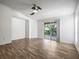 Bright living room with wood floors and sliding door access to balcony at 9481 Highland Oak Dr Dr # 508, Tampa, FL 33647