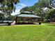 Community picnic area with tables and benches under a shaded pavilion at 9481 Highland Oak Dr Dr # 508, Tampa, FL 33647