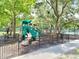 Well-maintained playground area with slides and swings enclosed by a fence at 9481 Highland Oak Dr Dr # 508, Tampa, FL 33647