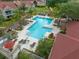 Overhead view of community pool with ample seating and landscaping at 9481 Highland Oak Dr Dr # 508, Tampa, FL 33647