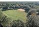 Aerial view of a recreational baseball field surrounded by lush trees at 9481 Highland Oak Dr Dr # 508, Tampa, FL 33647
