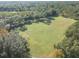 Aerial view of the recreational field with soccer goals and surrounding trees at 9481 Highland Oak Dr Dr # 508, Tampa, FL 33647