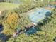 Overhead view of the community tennis courts and the surrounding green scenery at 9481 Highland Oak Dr Dr # 508, Tampa, FL 33647