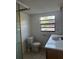 Bathroom featuring a toilet, vanity, and shower, with a window providing natural light at 9950 Morris Bridge, Tampa, FL 33637