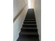 Stairway with carpeted steps and white walls leading to the upper level of the home at 9950 Morris Bridge, Tampa, FL 33637