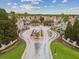 Scenic aerial view of The Villas condominiums featuring lush landscaping and charming entrances to the community at 10434 Villa View Cir, Tampa, FL 33647
