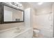 Bathroom with shower-tub combo, white cabinets, and vanity at 10434 Villa View Cir, Tampa, FL 33647