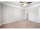 Bedroom featuring plush carpet, crown molding, ceiling fan, and connecting bathroom at 10434 Villa View Cir, Tampa, FL 33647
