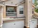 Close up exterior image showcasing the architectural details, balcony and garage of the building at 10434 Villa View Cir, Tampa, FL 33647