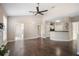 Open-concept living room featuring hard wood floors and easy access to the kitchen at 10434 Villa View Cir, Tampa, FL 33647