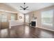 Spacious living room features hardwood floors, fireplace, and ceiling fan at 10434 Villa View Cir, Tampa, FL 33647