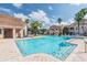 Inviting pool with clear blue water, surrounded by well-kept grounds and condo buildings in a tranquil setting at 10434 Villa View Cir, Tampa, FL 33647