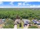Aerial view of home and wooded surroundings with private pool at 10509 Deepbrook Dr, Riverview, FL 33569