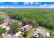 Aerial view of property showcasing mature trees and large yard at 10509 Deepbrook Dr, Riverview, FL 33569