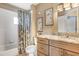 Bathroom with shower/tub combo and full vanity with storage at 10509 Deepbrook Dr, Riverview, FL 33569