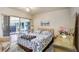 Comfortable bedroom with ceiling fan and sliding glass doors to the outside at 10509 Deepbrook Dr, Riverview, FL 33569