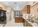 Spacious kitchen featuring granite countertops, tile flooring, and black appliances at 10509 Deepbrook Dr, Riverview, FL 33569