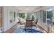 Inviting sunroom with plenty of windows, a ceiling fan, and an inviting seating area at 10509 Deepbrook Dr, Riverview, FL 33569